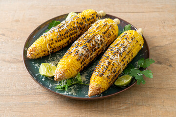 barbecue and grilled corn with cheese and lime