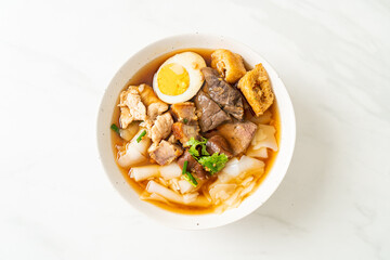 paste of rice flour or boiled Chinese pasta square in clear soup
