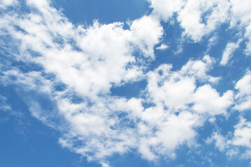 Textures background abstract of white clouds like a large fluffy ball in midst of blue sky with bright sunlight. Sky blue and white big fluffy like fluffy clouds beautiful with bright sunlight nature