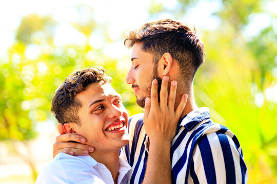 young gay couple embracing and showing their love to everyone
