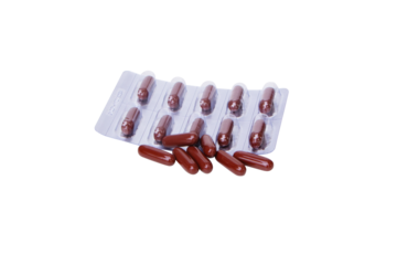 Drug capsule. Medicine is a capsule brown that is placed in a panel. Vitamin strengthens immune system. Body's immune response after the vaccine is good. Isolated on cutout PNG.	
