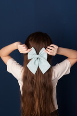 little girl with a bow in her hair.