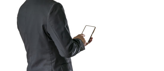 The Asian man in a black suit is standing alone and holding a phone.