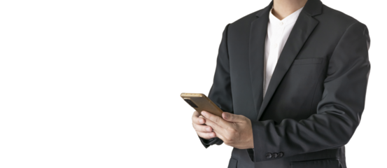 The Asian man in a black suit is standing alone and holding a phone.