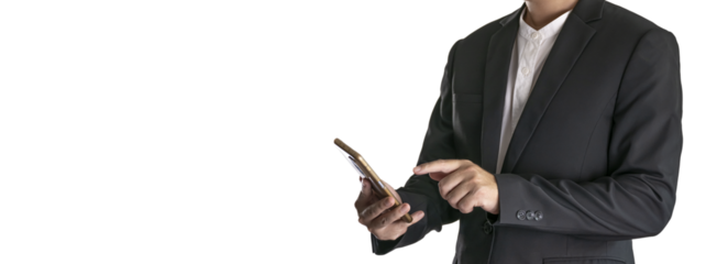 The Asian man in a black suit is standing alone and holding a phone.