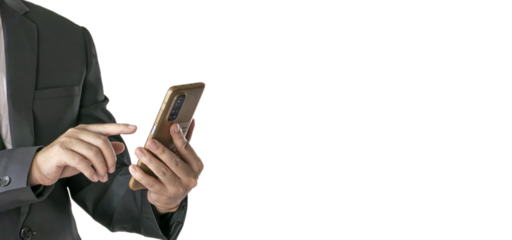 The Asian man in a black suit is standing alone and holding a phone.