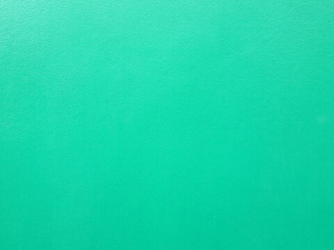 pastel green paint on rough concrete floor or wall texture background