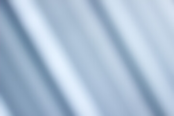 Fototapeta na wymiar abstract blurred blue fabric wave background
