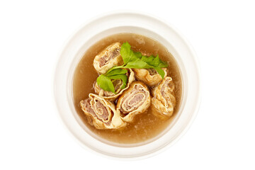 Top view of Clear Soup with Minced pork tenderloin and Egg Roll sprinkled with celery leaves isolated on with background. Foods that are highly nutritious and healthy.