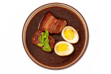 Top view of Egg and Pork in Sweet Brown Sauce in bowl isolated on white background, 2 boiled eggs, braised pork and cilantro. popular food in asia.