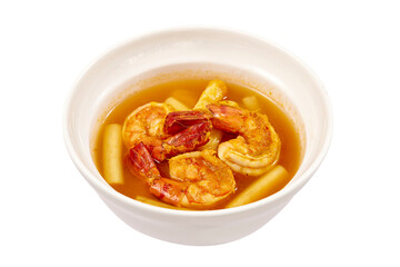 Sour soup with lotus stem and shrimps in a white bowl isolated on white background. local food of Thailand.