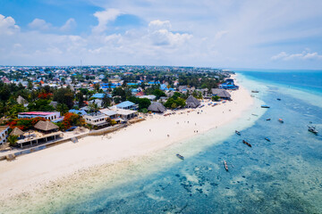 Spend your vacation in Zanzibar's picturesque Nungwi, where you can soak up the sun and admire the local fishing boats dotting the beach.