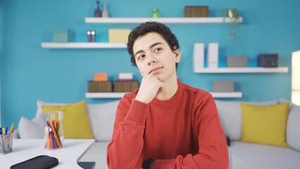 Clever boy studying to achieve his dreams.
A happy child dreams and studies to achieve his dreams.
