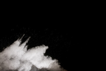 Fototapeta na wymiar White powder explosion cloud against black background.White dust particles splash.