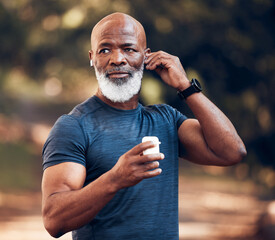 Black man, wireless earphones and running outdoor in park, nature or garden for healthy workout. Senior sports male listening to music to start training with radio, fitness and motivation of exercise