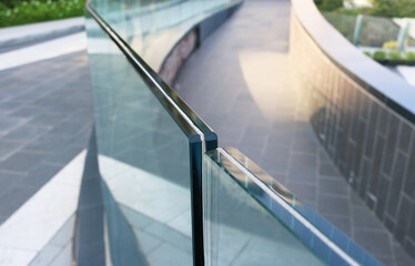 Toughened frameless laminated glass railing for exterior installation.	
