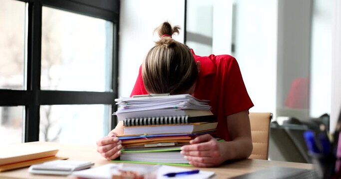 Overworked business woman or distressed secretary with lot of paperwork
