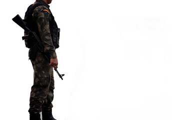 Security person army commando is standing against isolated white background with assault rifle