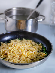 Pasta with pesto.Cooking process step by step in the kitchen.