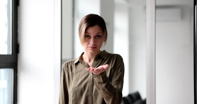 Beautiful woman shows a gesture with hands to give money