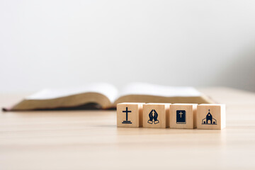 Wooden block with holy bible icon, prayer, worship in the church of Christian or catholic religion...