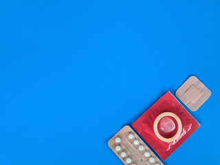 Various contraceptives for pregnancy on colored background