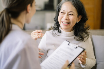 Concerned senior old patient patient talks with healthcare professional.