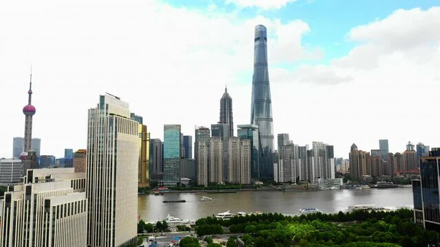 Aerial Panning Shot Of Shanghai Tower In Modern Downtown Under Cloudy Sky
