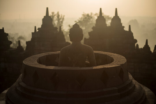 Buddha statue at the Borobudor temple in Java, Indonesia.