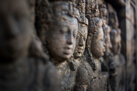 Buddhist stone carvings at the Borobudur temple in Java, Indonesia.