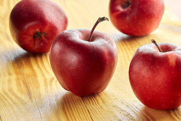 Red apples on a wooden table