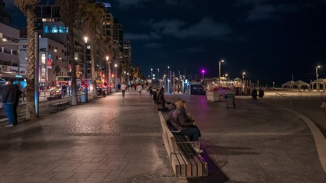 Tel Aviv night promenade people and transportation time lapse hyperlaspe 4k. Israel
