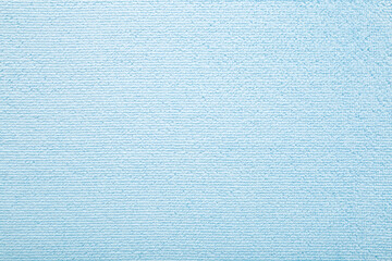 Light blue dry soft microfiber rag background. Closeup. Pastel color. Empty place for text. Top...