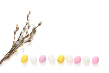 willow branches  on white background. candy Easter eggs. Element for the theme of religion, Palm Sunday and Easter.	 - obrazy, fototapety, plakaty