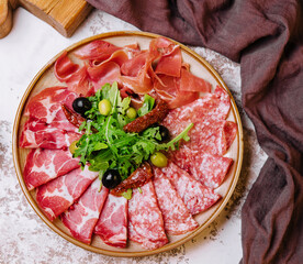 Traditional spanish jamon, prosciutto crudo, italian salami