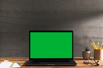 Chroma key green screen laptop on table, working space