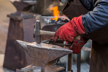 Moscow seasons. Traditional craft. The work of a blacksmith with metal at the celebration of...