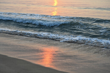 photo ofsea wave in morning sunrise