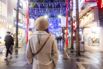 Woman visit Taipei city in the evening