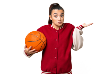 Young Woman playing basketball over isolated chroma key background having doubts while raising hands