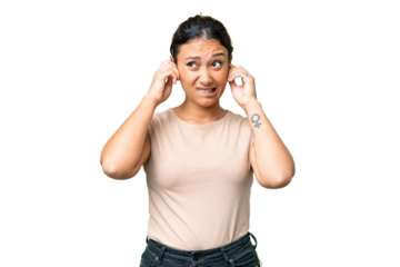 Young Uruguayan woman over isolated chroma key background frustrated and covering ears