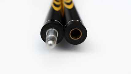 Billiard cues on a white background. Parts of a billiard cue close-up. Live photos of a billiard cue