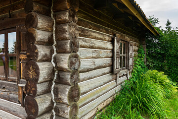 The corner and the wall of a Russian village log hut