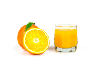 On white background the glass of orange juice, whole and half of an orange