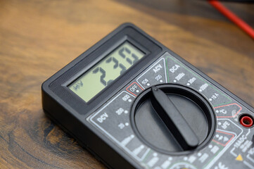 close-up of the screen testing a multimeter during a test of current strength during home renovation.