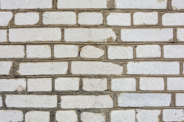 Grey brick wall on cement mortar, background, structure