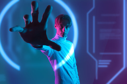 human vs hi-tech machine with the ability of deep learning while man hold hand to interactive virtual touch graphic  and try to understand the ai innovation of the future