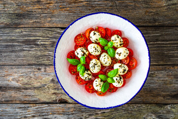 Caprese salad on wooden board
