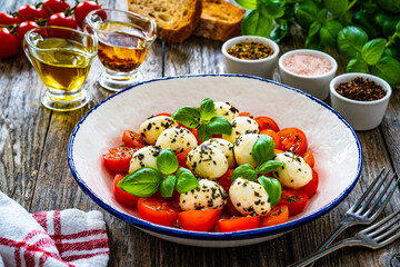 Caprese salad on wooden board

