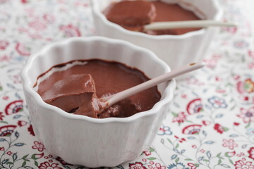 Macro shot of chocolate pudding served in baking dishes